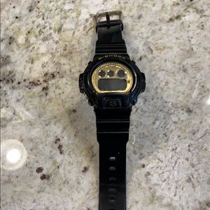 Black and gold gshock watch